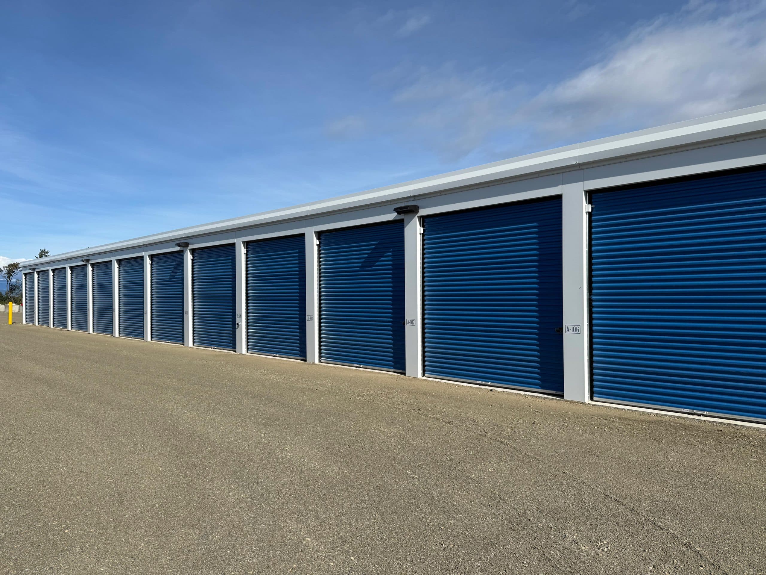 Row of modern self-storage units with roll-up doors in Parksville