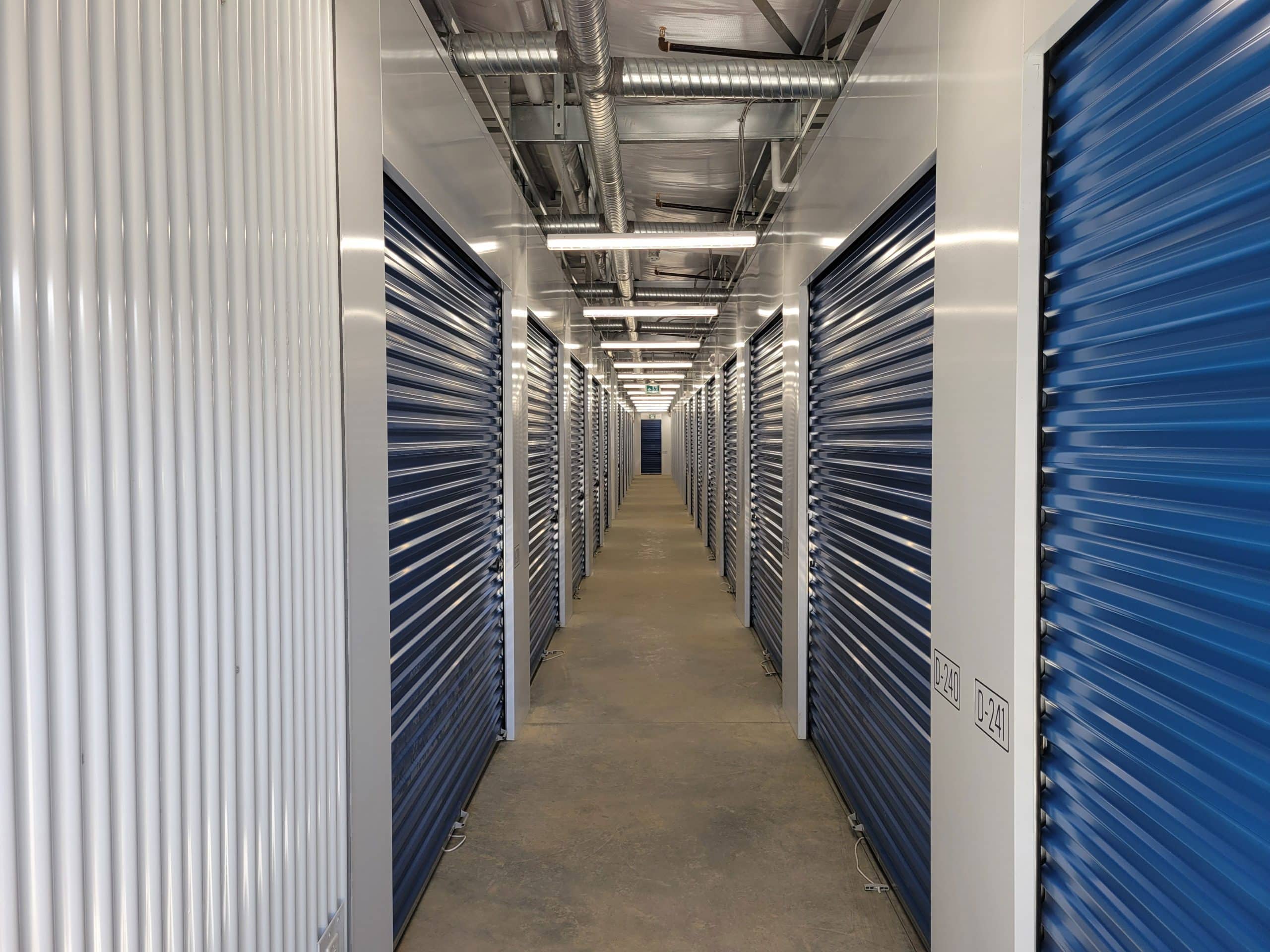 Well-lit interior hallway with secure storage units at All Access Storage Parksville.