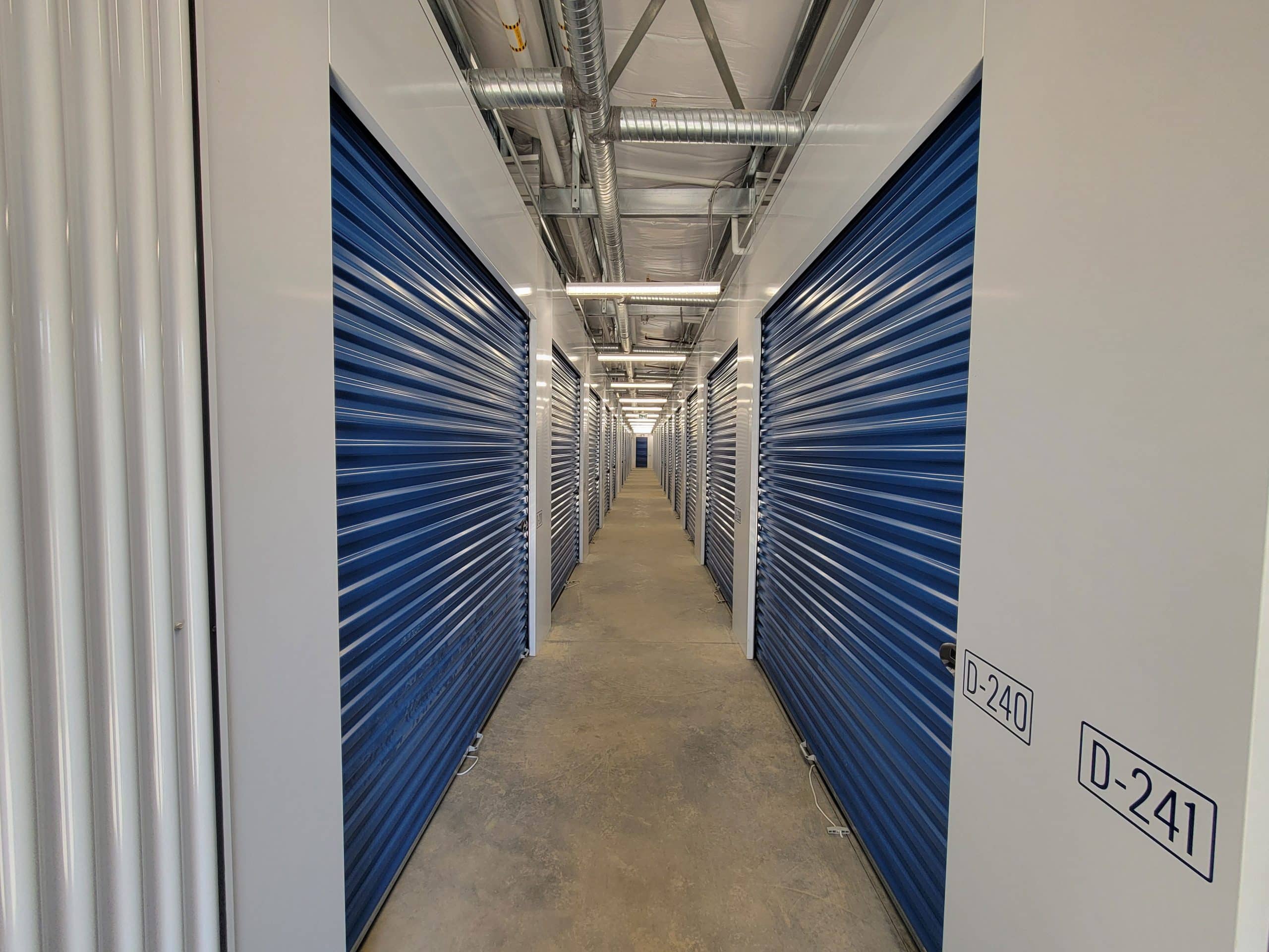 Well-lit interior hallway with secure storage units at All Access Storage Parksville.