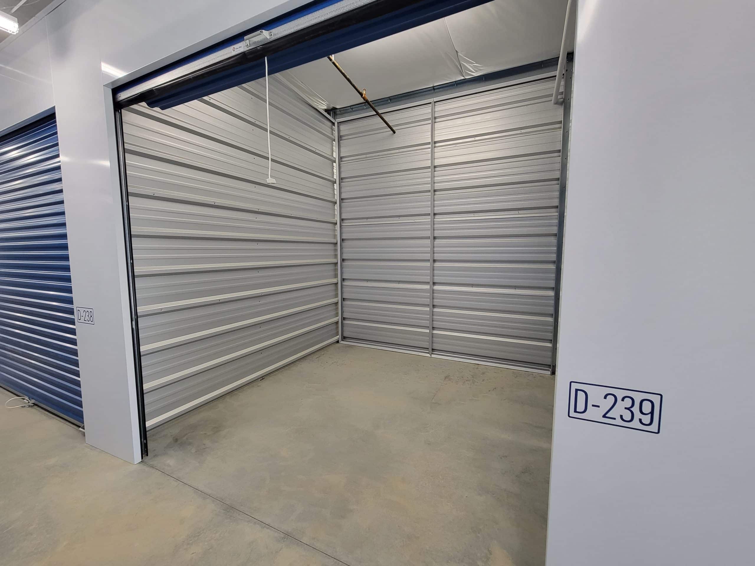 Clean, empty storage unit with roll-up door at All Access Storage Parksville.