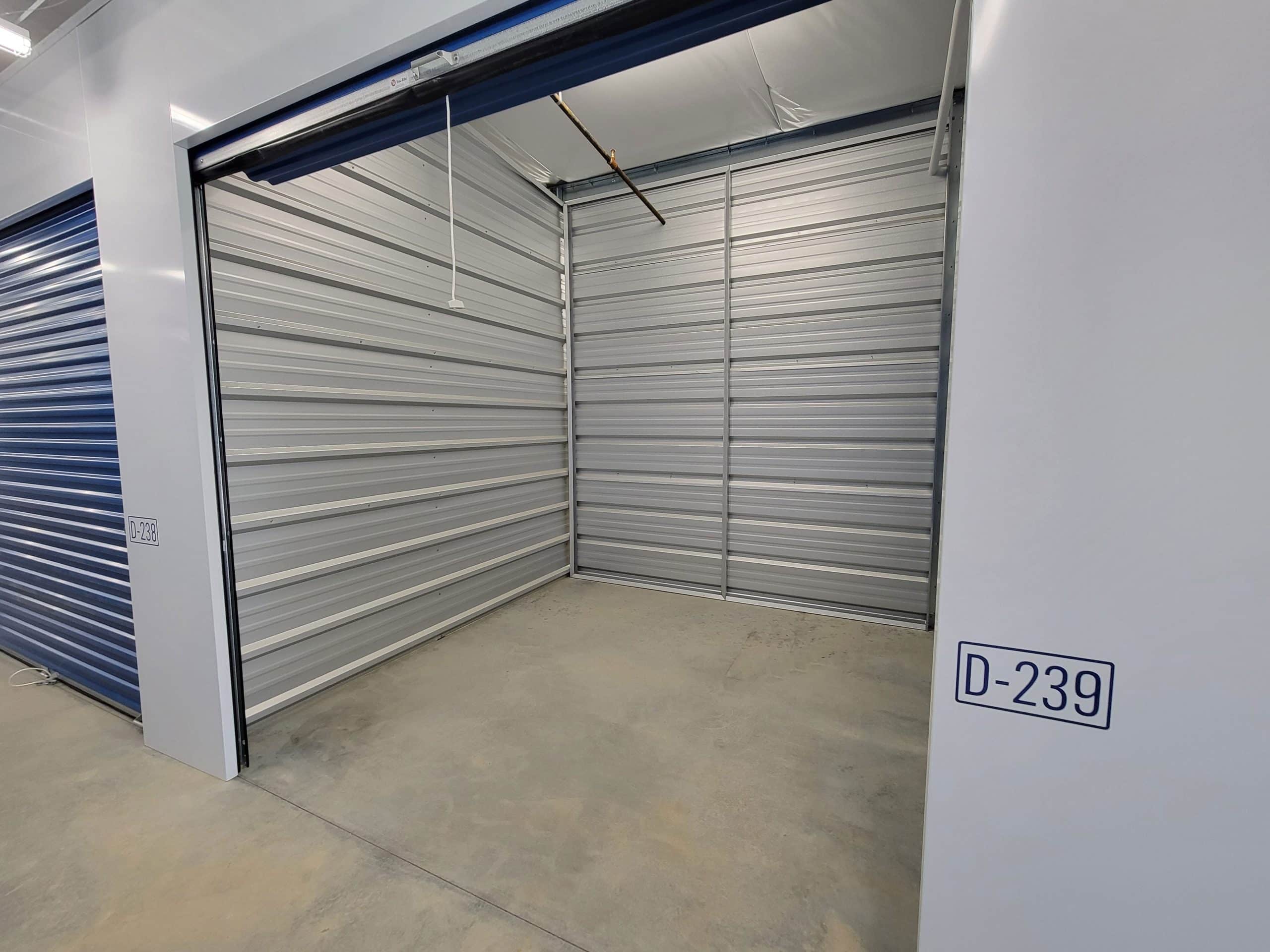 Clean, empty storage unit with roll-up door at All Access Storage Parksville.