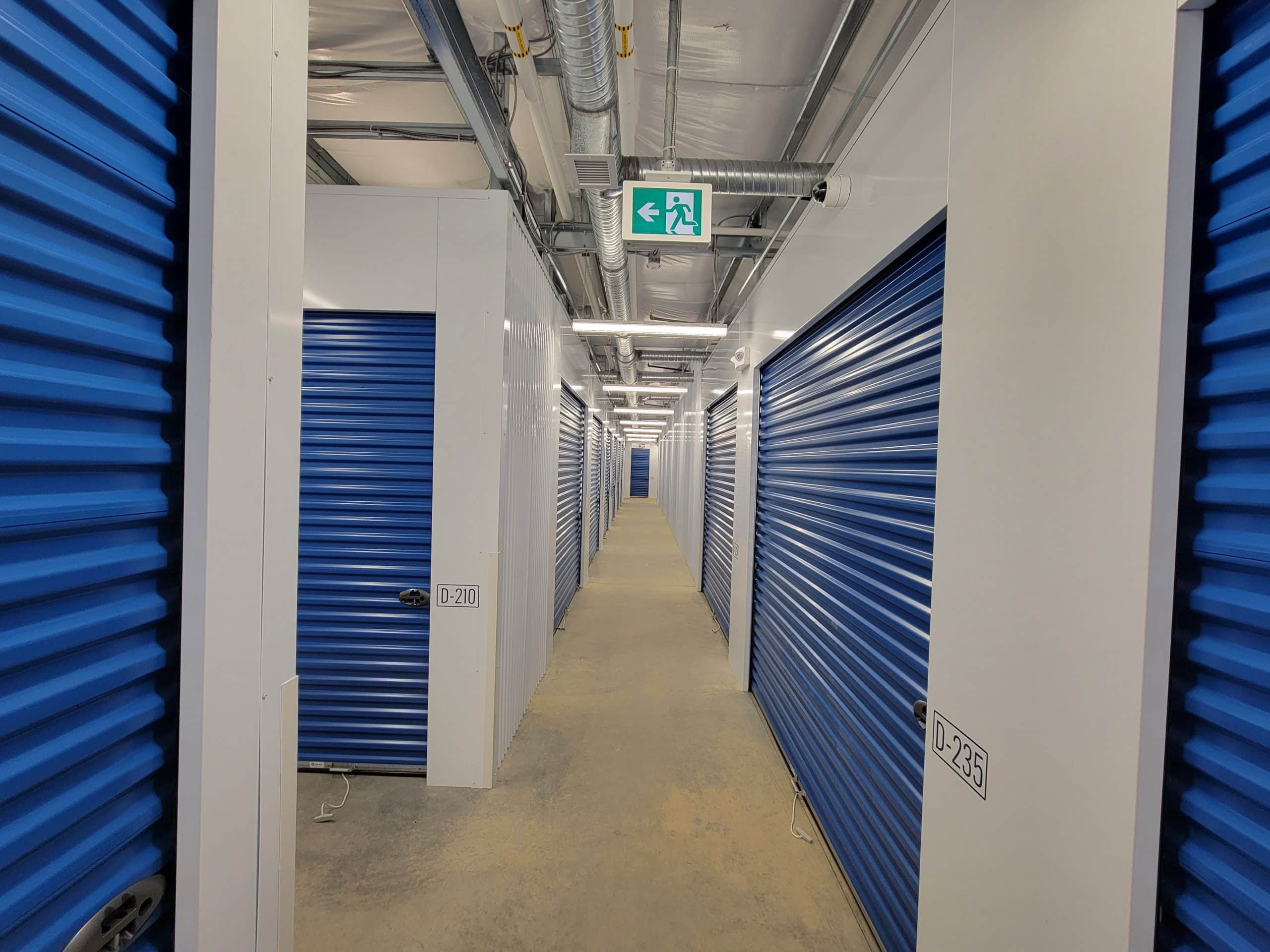 Well-lit interior hallway with secure storage units at All Access Storage Parksville.