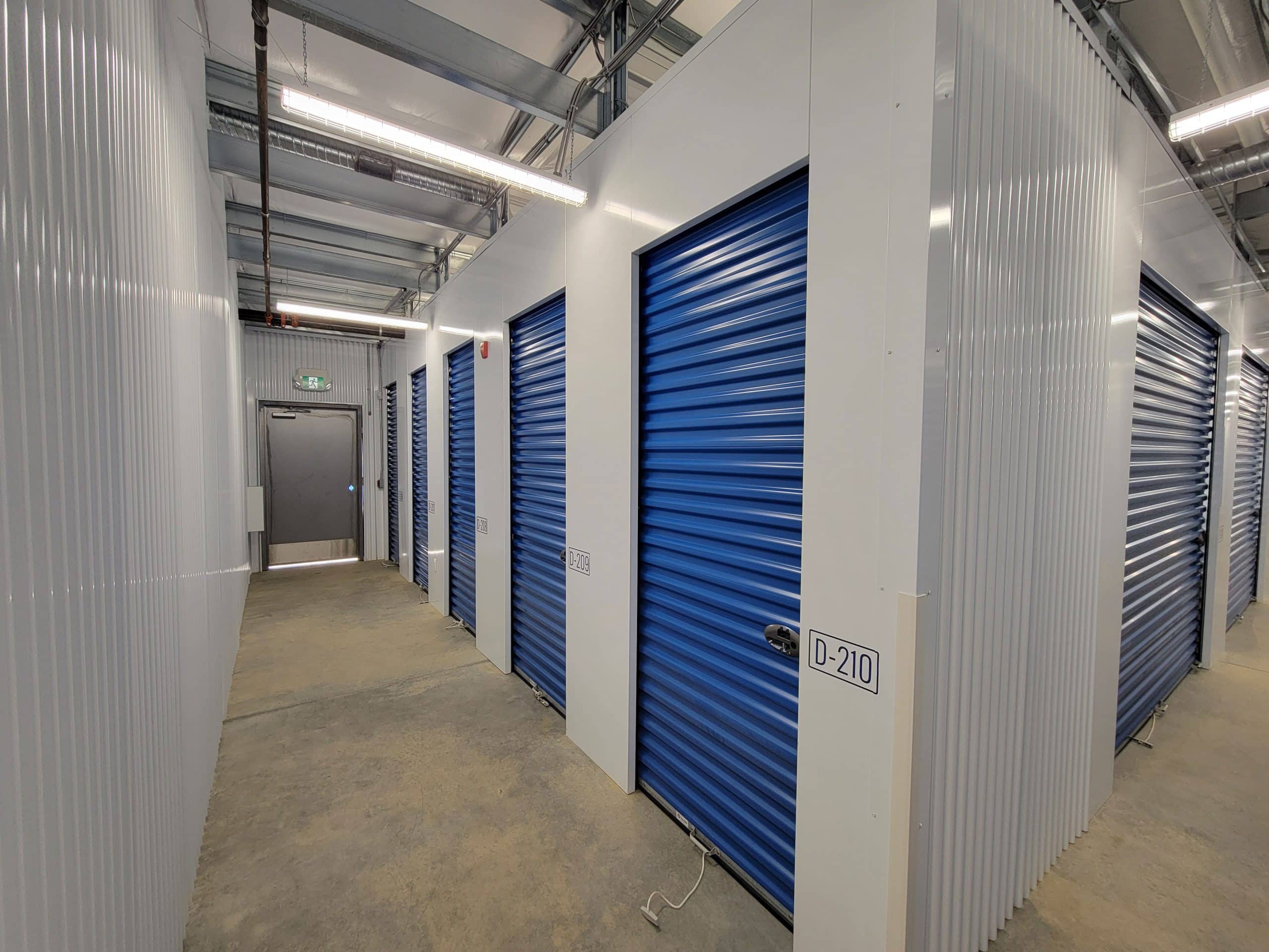 Well-lit interior hallway with secure storage units at All Access Storage Parksville.