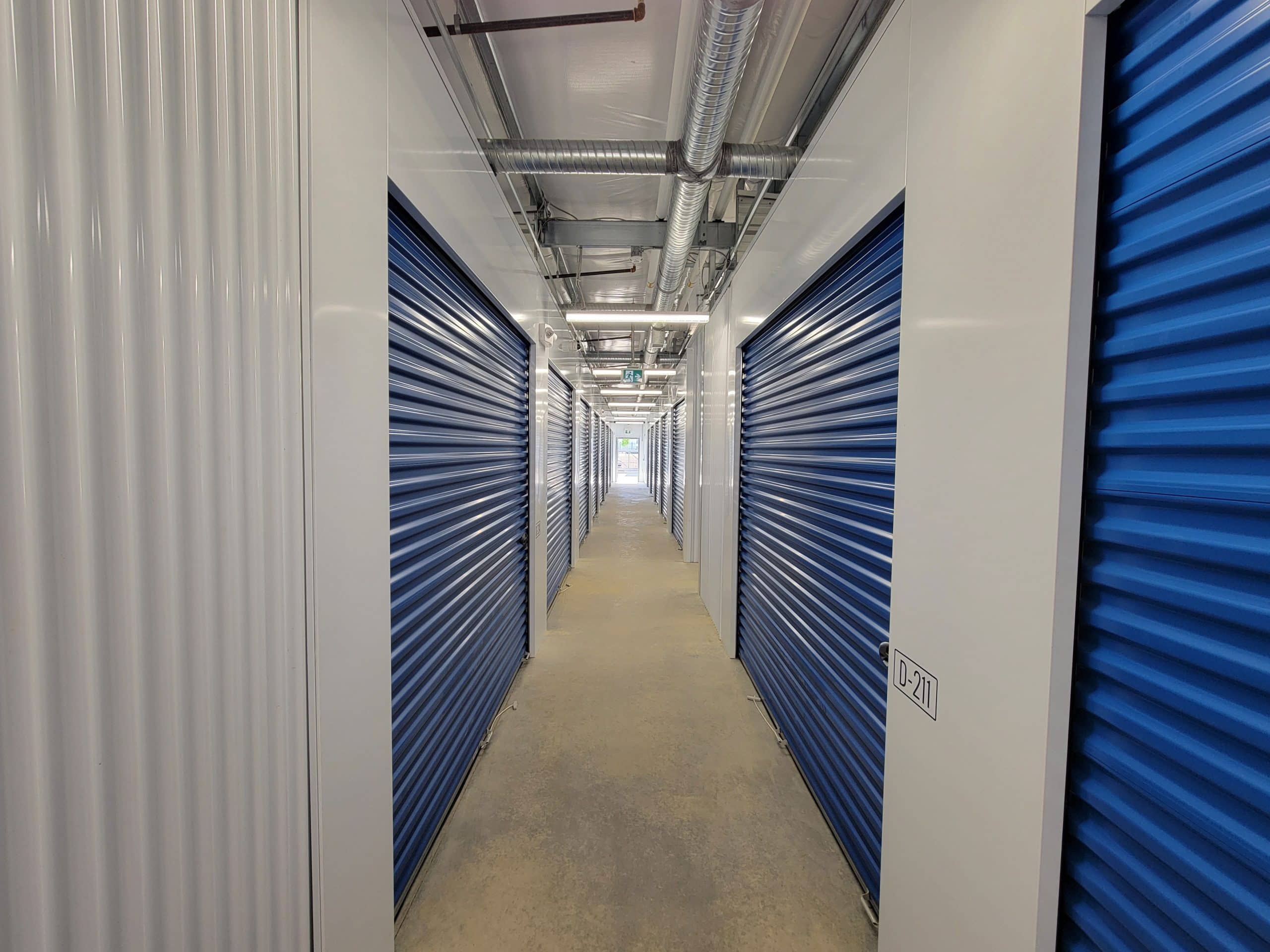 Well-lit interior hallway with secure storage units at All Access Storage Parksville.