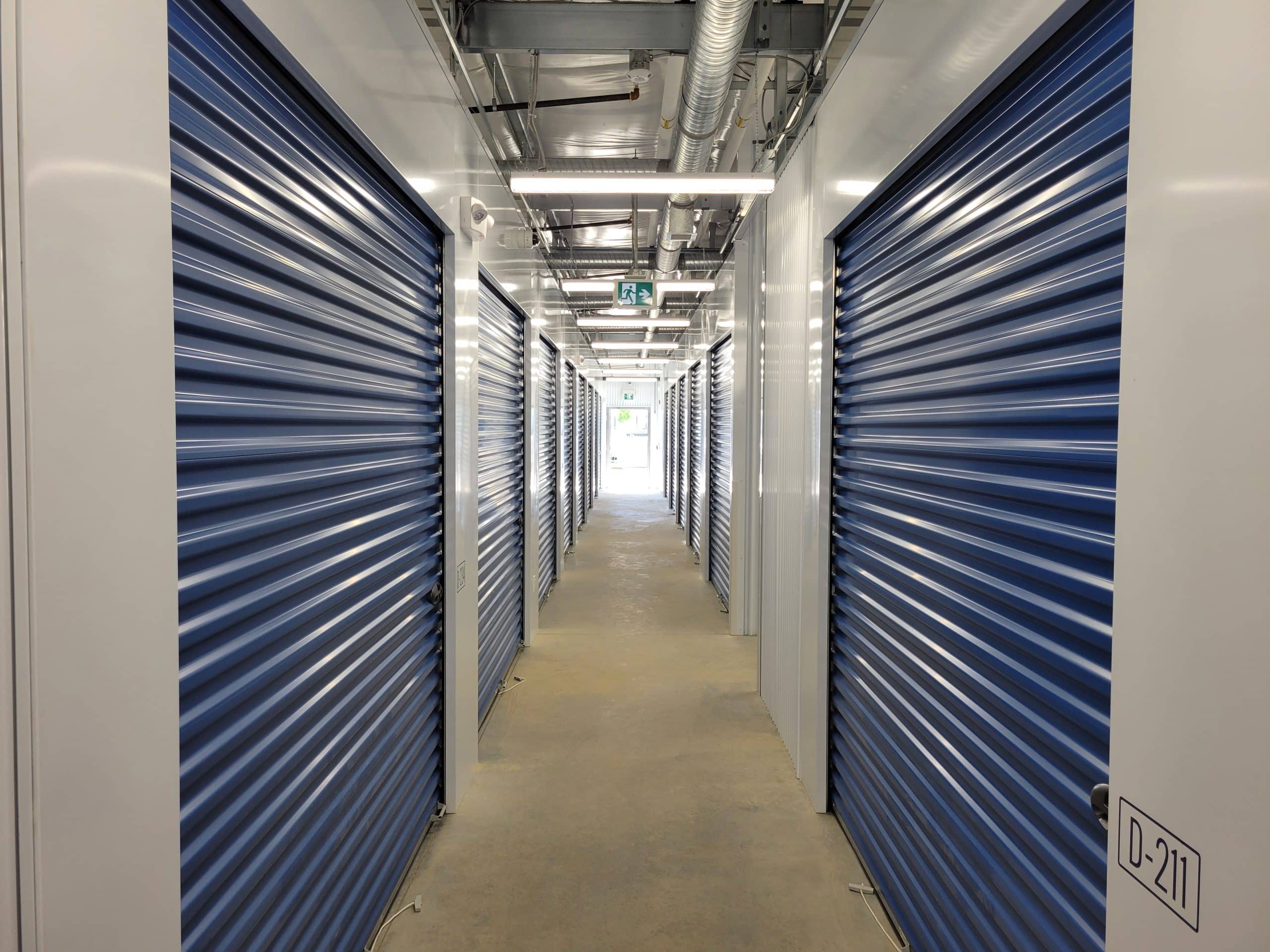 Well-lit interior hallway with secure storage units at All Access Storage Parksville