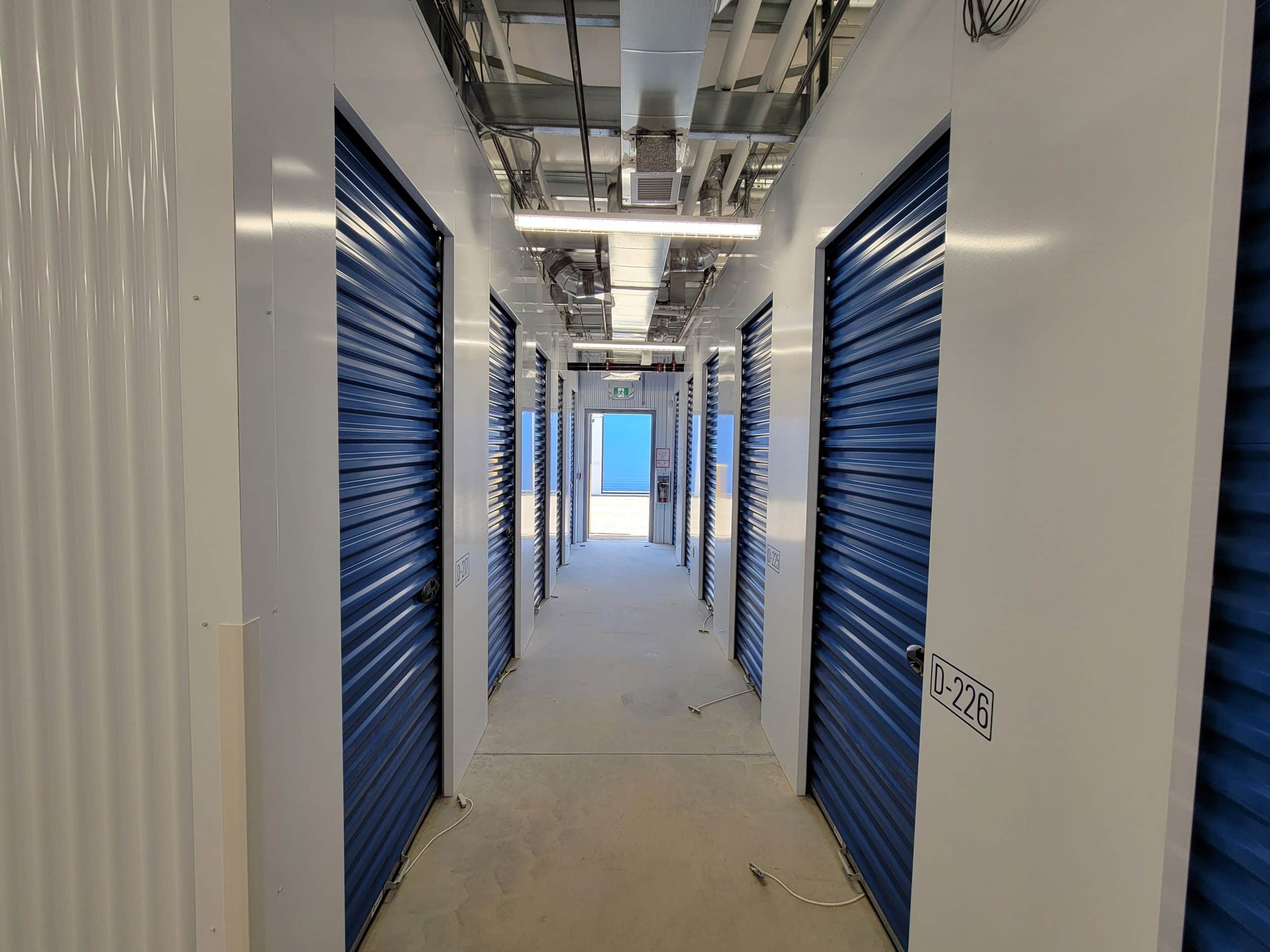 Well-lit interior hallway with secure storage units at All Access Storage Parksville.