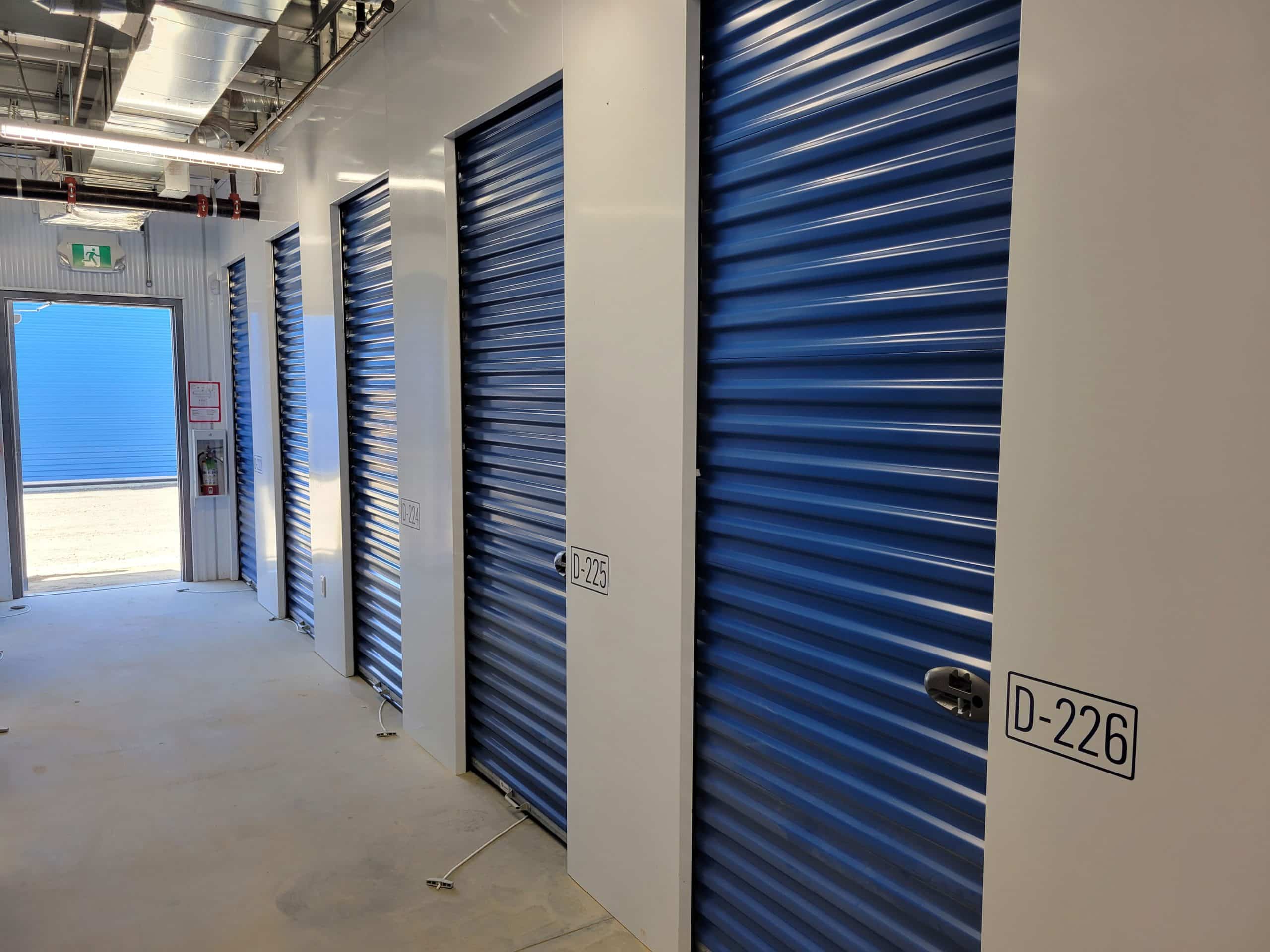 Well-lit interior hallway with secure storage units at All Access Storage Parksville.