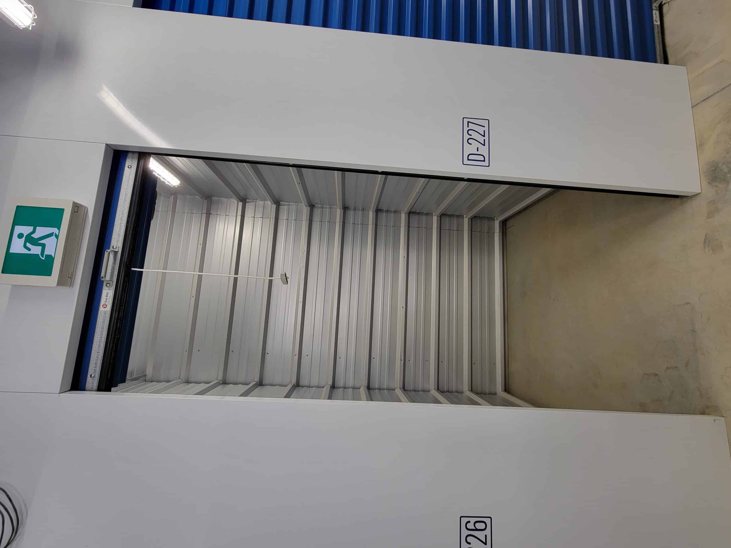 Clean, empty storage unit with roll-up door at All Access Storage Parksville.