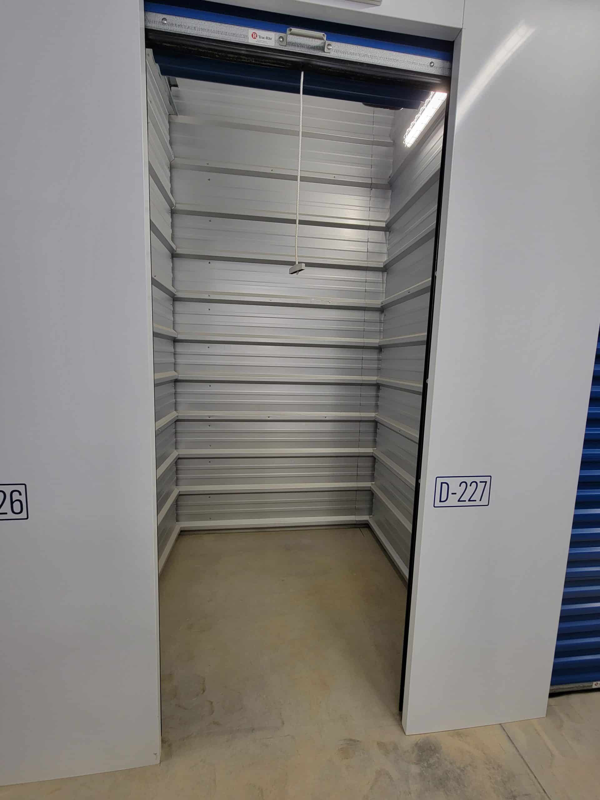 Clean, empty storage unit with roll-up door at All Access Storage Parksville.