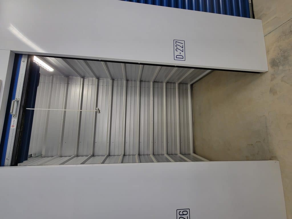 Clean, empty storage unit with roll-up door at All Access Storage Parksville.