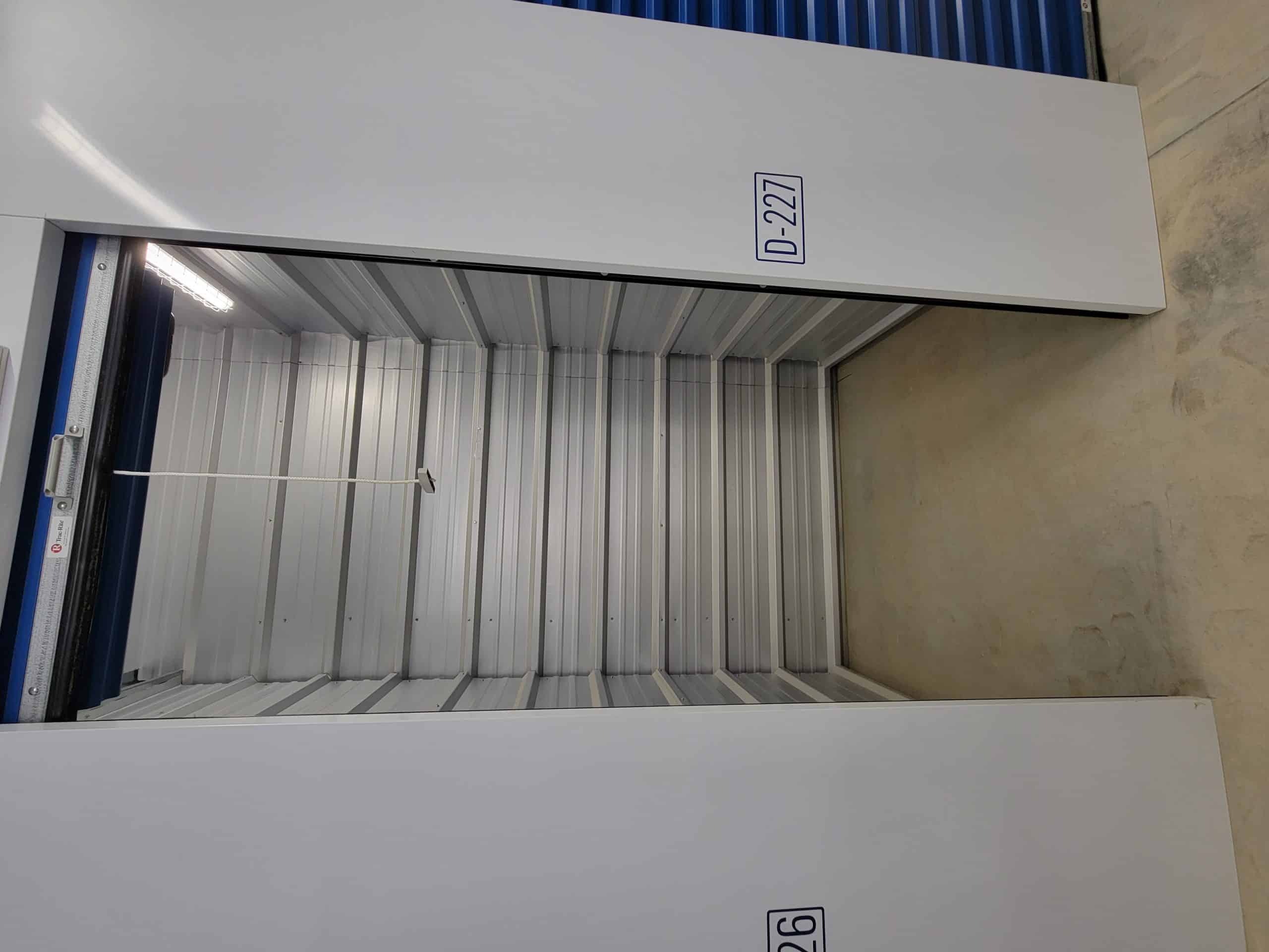 Clean, empty storage unit with roll-up door at All Access Storage Parksville.