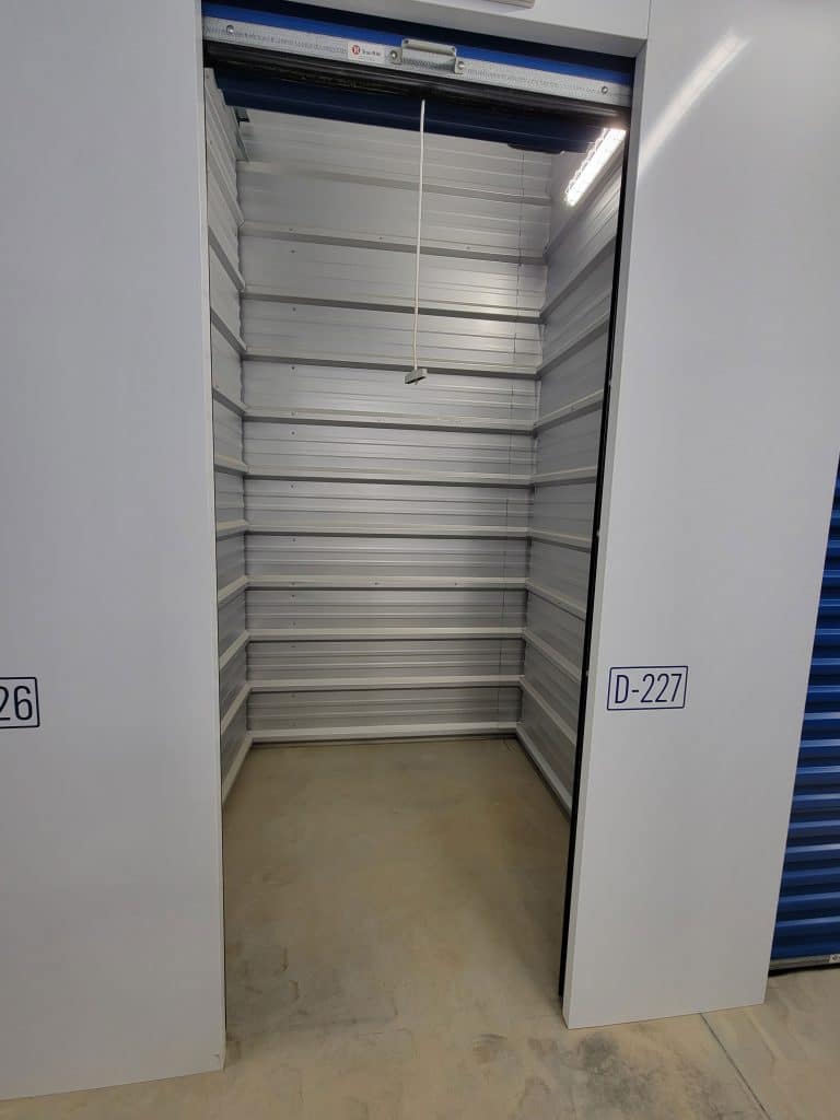 Clean, empty storage unit with roll-up door at All Access Storage Parksville.