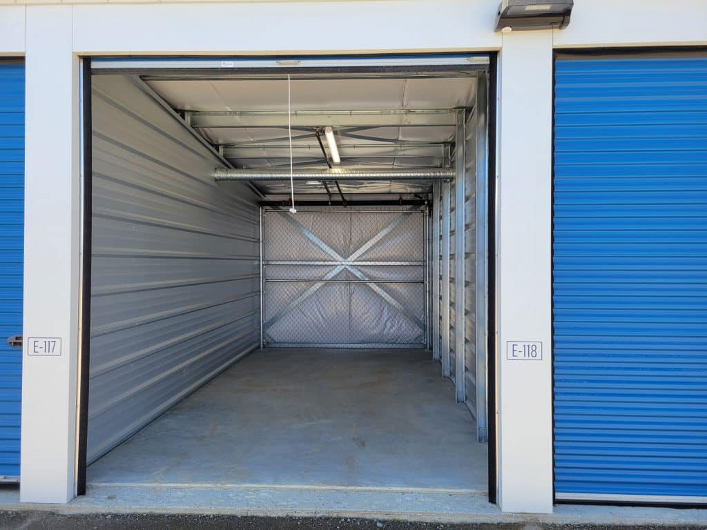 Clean, empty storage unit with roll-up door at All Access Storage Parksville.